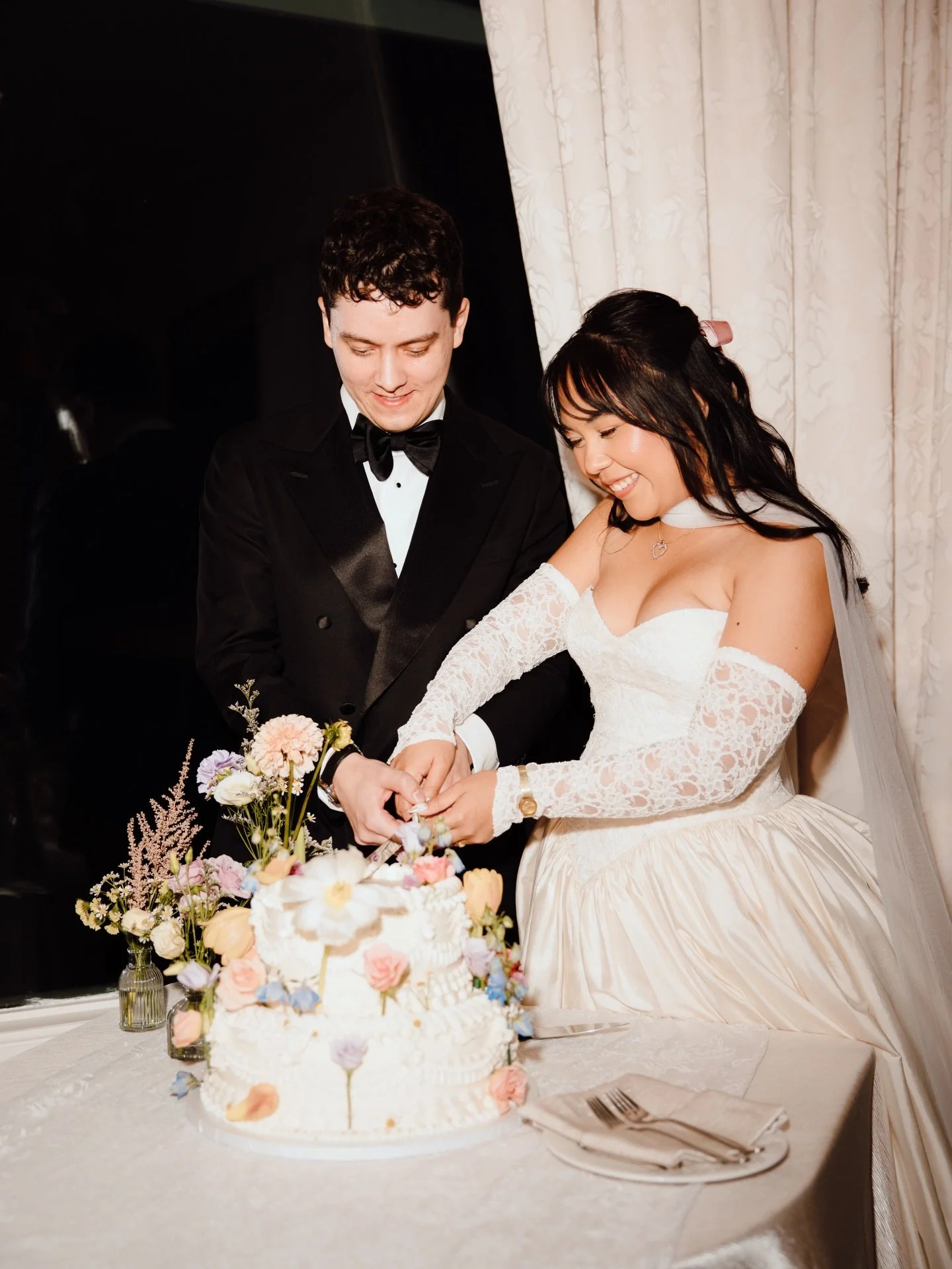 Bride Areej in a 1990s basque-waist gown with sweetheart neckline and raw silk skirt