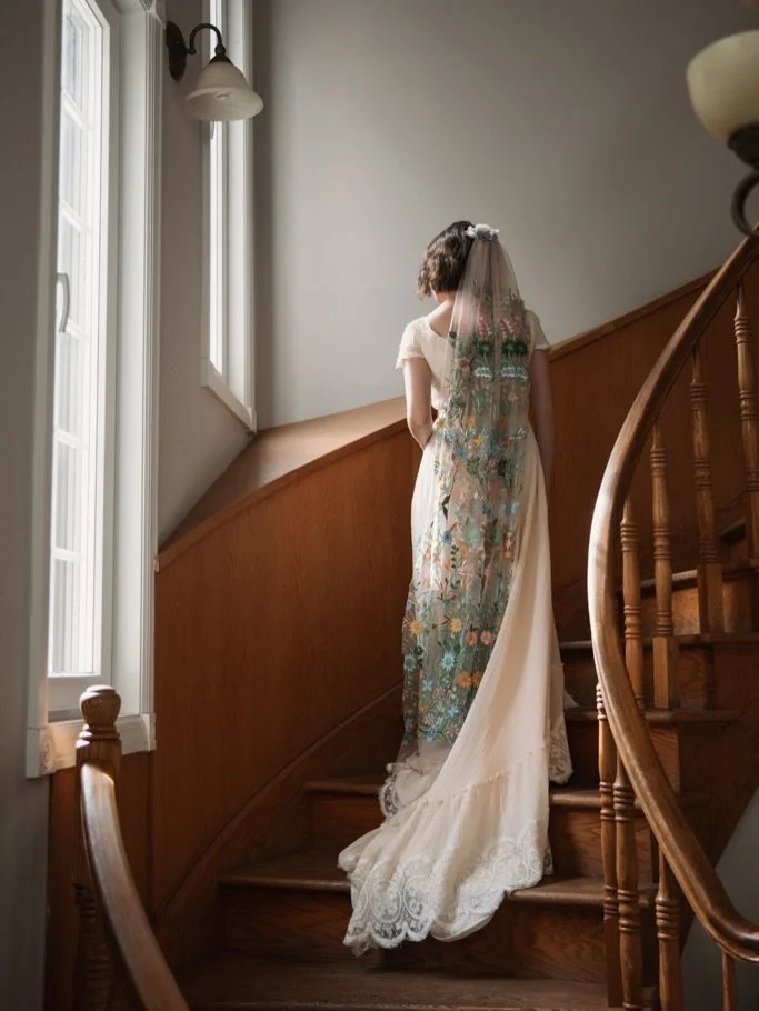 Bride Erin in a delicate late-1970s cotton plissé gown with an embroidered floral veil