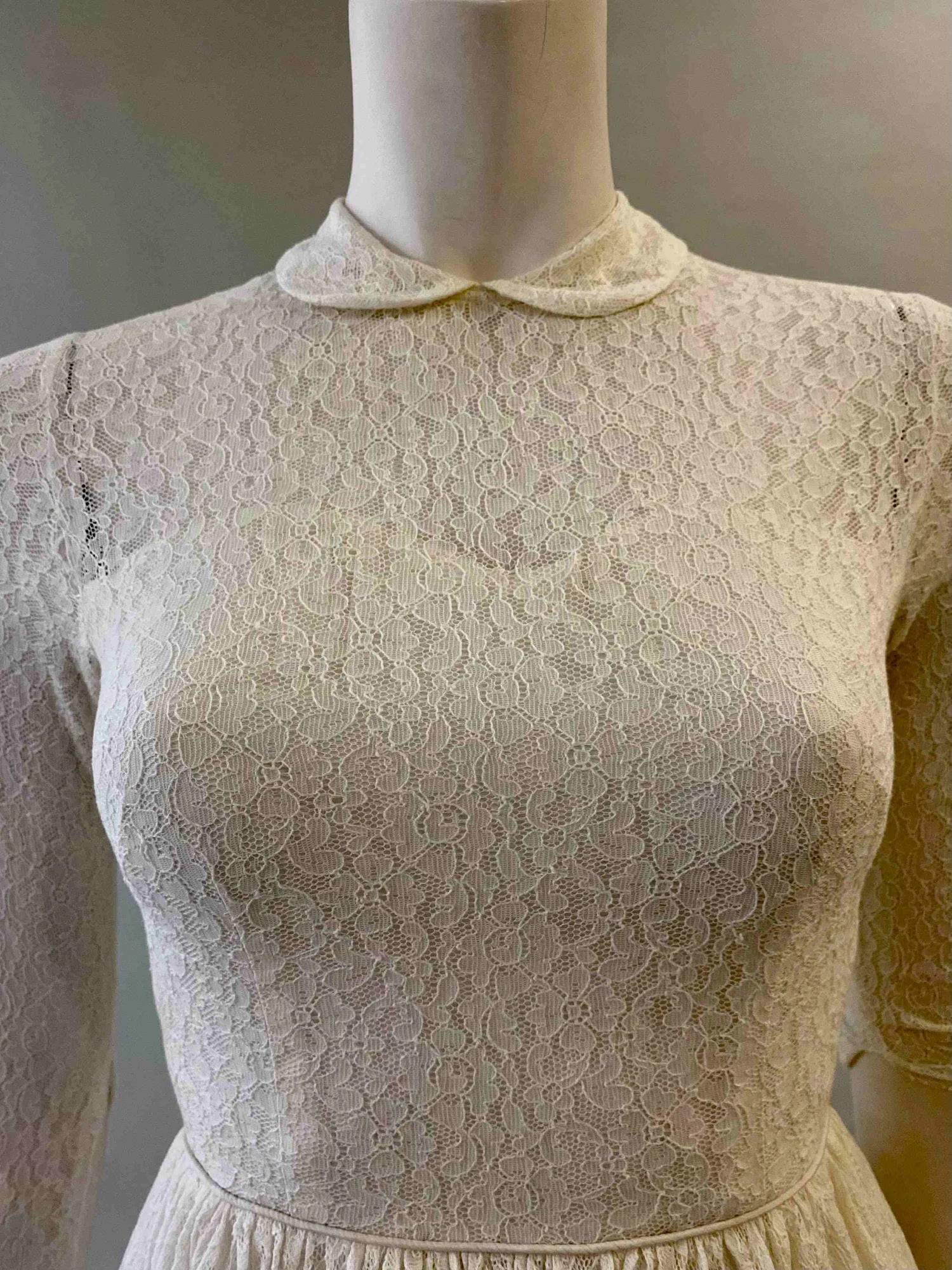Detail of a 1950s tulle and cotton lace gown in the salon